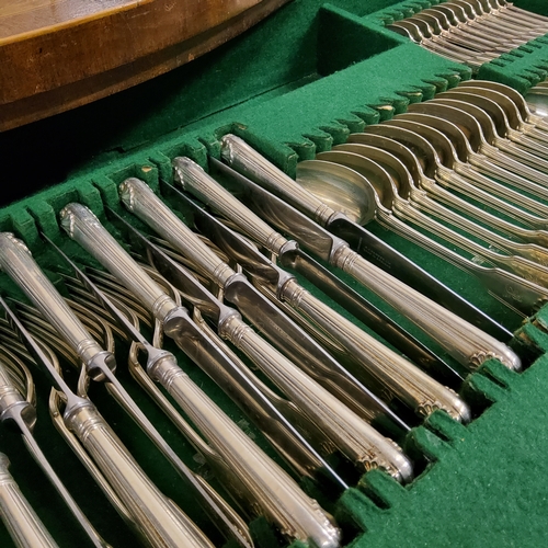 9 - A Victorian canteen of Fiddle and Shell pattern flatware,  for twelve, comprising dinner knives and ... 