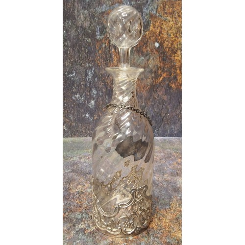 65 - A Victorian wrythen clear glass liqueur bottle and stopper, silver sleeve, pierced with C-scrolls, f... 