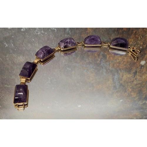 94 - A 9ct gold Art Deco style bracelet, each link set with a polished amethyst rectangular arched stone,... 