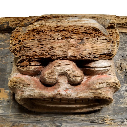 509 - A large 16th / 17th century Continental carved oak panel, traces of polychromy on the two masks, the... 