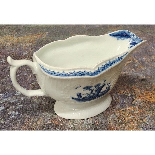 252 - A Worcester Little Fisherman pattern sauce boat, loop handle, scroll thumb piece, painted in undergl... 