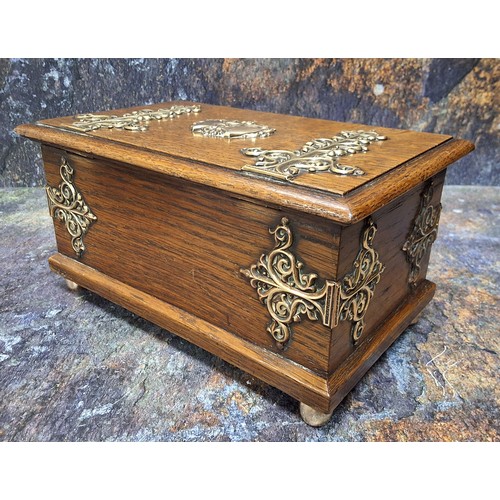 448 - A Victorian oak cigar box, with bold brass foliate hinges, 11cm high, 21.5cm wide, c.1880