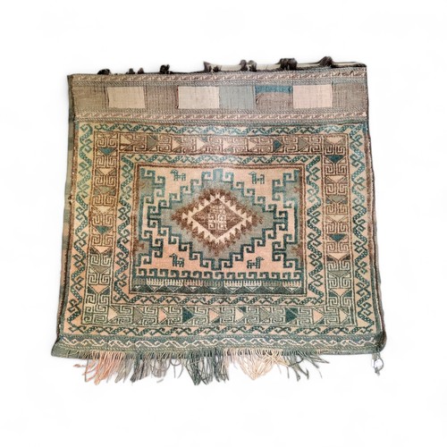 743 - A Middle Eastern woollen salt bag, with central lozenge, geometrical banded border, 71cm x 77cm