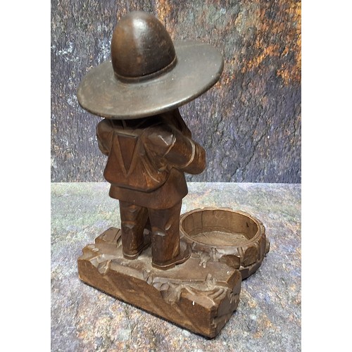 449 - A 19th century Black Forest desk tidy, as a dwarf standing by a well, 17cm high, c.1880