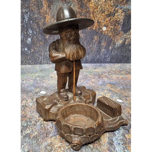 449 - A 19th century Black Forest desk tidy, as a dwarf standing by a well, 17cm high, c.1880