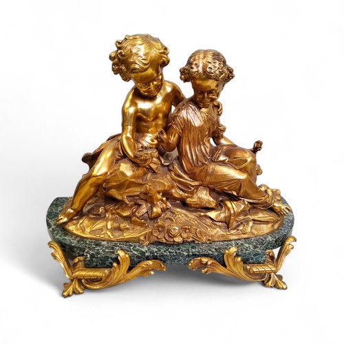 501 - French School, late 19th century, gilt bronze sculpture of two children with a bird's nest, green ma... 