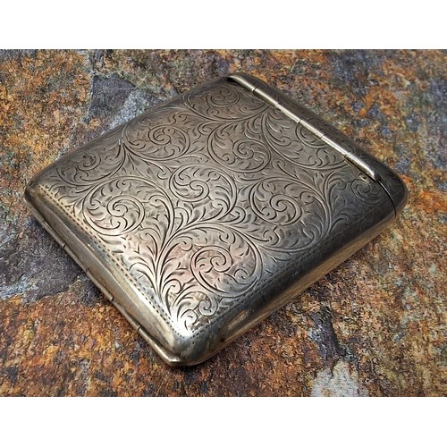 30 - An unusual George V silver rounded rectangular cigarette case, hinged cover, engraved and chased wit... 