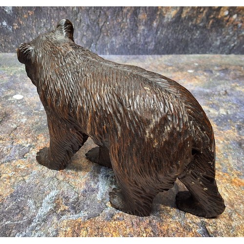 425 - An early 20th century Black Forest Black Forest bear, standing, 11cm high, c.1900