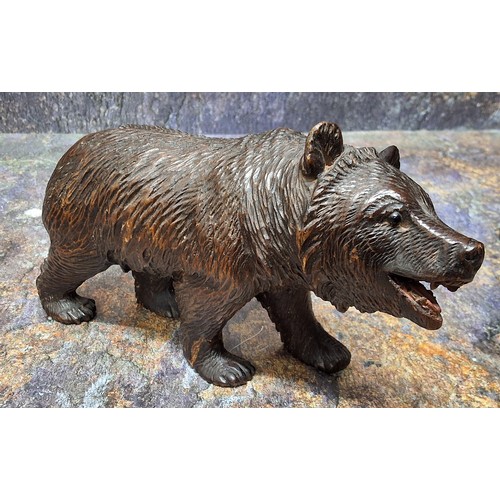 425 - An early 20th century Black Forest Black Forest bear, standing, 11cm high, c.1900