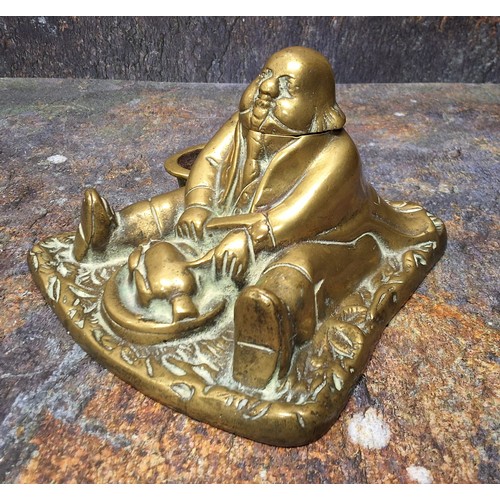 422 - A 19th century brass novelty inkwell, cast as a portly gentleman, seated, 15cm wide, c.1860