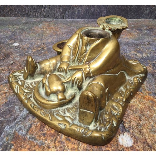 422 - A 19th century brass novelty inkwell, cast as a portly gentleman, seated, 15cm wide, c.1860