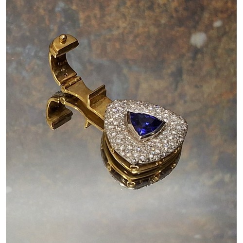 75 - A 18ct gold South African Tanzanite and diamond Reuleaux shaped pendant, a central collett set Trill... 