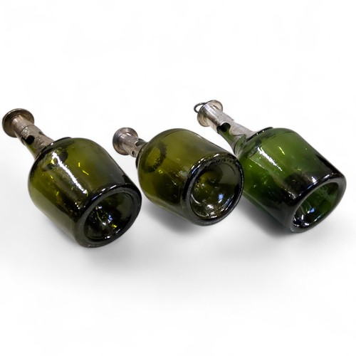 472 - Masonic Interest  - a set of three 18th century green glass bottles, kick-up pontil bases, each appl... 