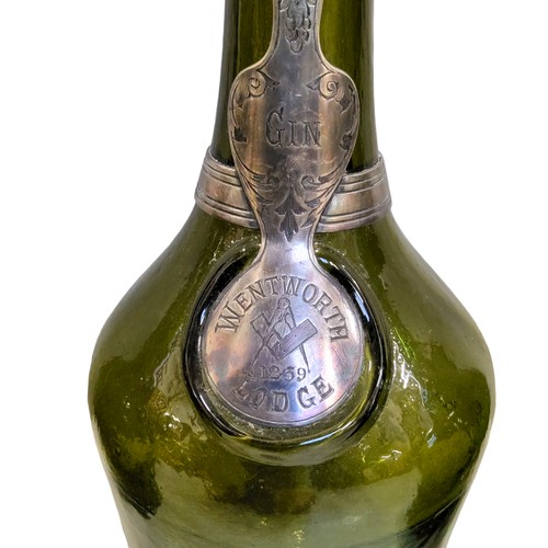 472 - Masonic Interest  - a set of three 18th century green glass bottles, kick-up pontil bases, each appl... 