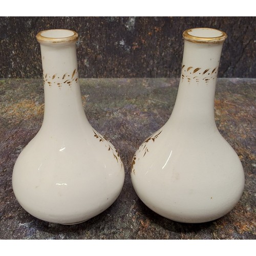 190 - A pair of Derby bottle vases, decorated in the manner of Daniel Lucas, with cottage and river landsc... 