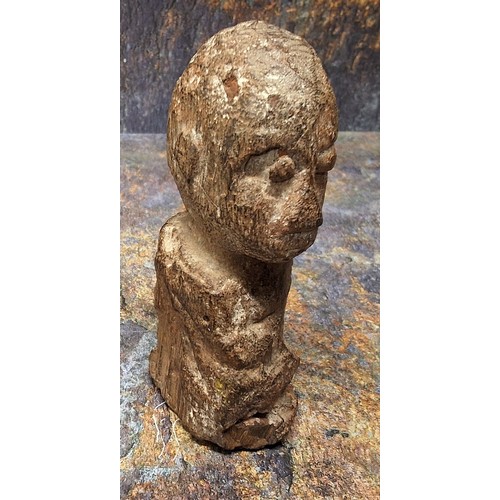 851 - An unusual fossilized wood carving, of a head, 12cm high