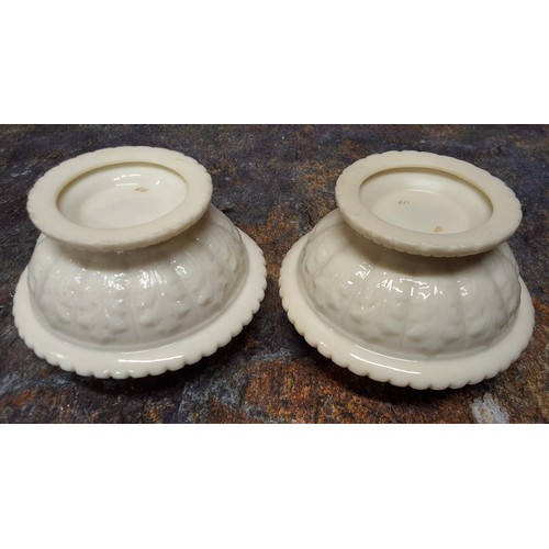 246 - A pair of Graingers Worcester reticulated pot pourri vases, in relief with stiff acanthus leaves,  g... 