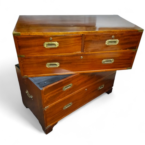 803A - A 19th century mahogany campaign chest of two short above three long drawers, two sections, each wit... 