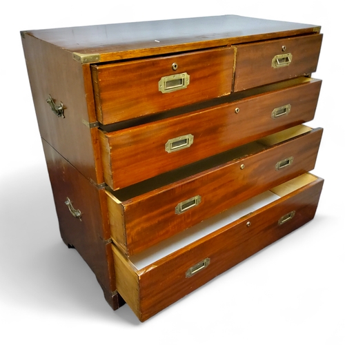 803A - A 19th century mahogany campaign chest of two short above three long drawers, two sections, each wit... 