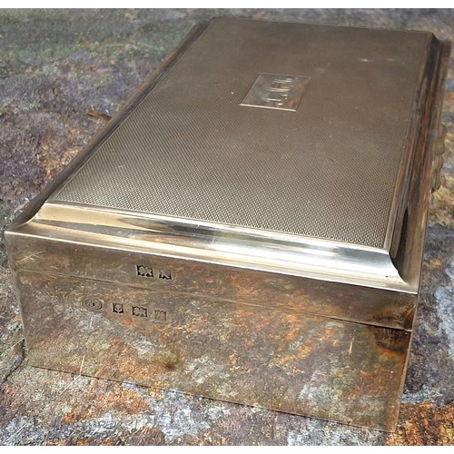 16 - A George V silver cigarette box, engine turned, cedar lined,  17cm wide, Birmingham 1959