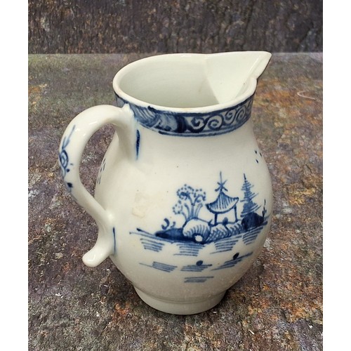 170 - A Lowestoft sparrow-beak jug,  painted in underglaze blue with a chinoiserie landscape with pagoda, ... 