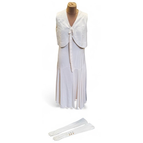 613 - Edward Molyneux (1891-1974) - a Molyneux Modes cream silk dress, c.1920;  a pair of long cream kid l... 