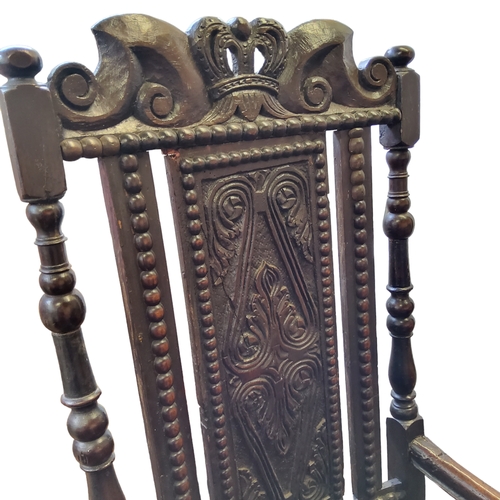 871 - An 18th century and later open armchair, crown and scroll carved pediment over foliate s-scroll carv... 