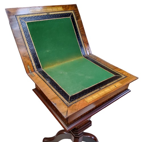 878 - A Victorian walnut work/games compendium,  inlaid in coloured woods with chessboard, conforming... 