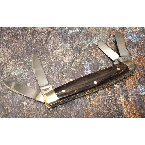 630 - A Stan Shaw four blade pocket knife, polished horn scales, vacant cartouche, workback to springs and... 