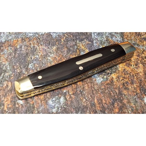 630 - A Stan Shaw four blade pocket knife, polished horn scales, vacant cartouche, workback to springs and... 