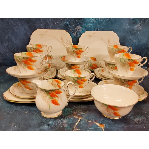 51 - A Shelley Wisteria pattern tea service, for twelve, comprising eleven cups, twelve saucers and side ... 