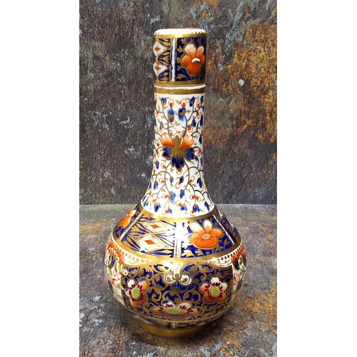 58 - A Derby bottle vase and cover, decorated in the Imari palette, 25cm high, crown, crossed batons and ... 