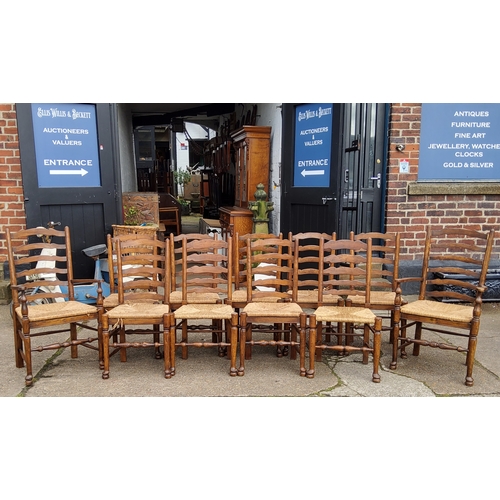 738 - A good set of twelve late 19th century oak country kitchen chairs, drop-in rush seats including two ... 