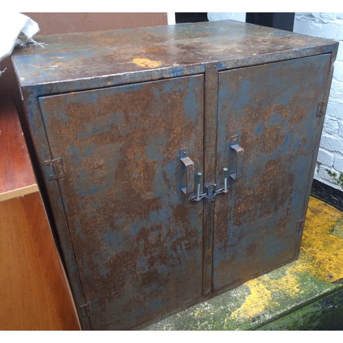 768 - A metal two door tool cabinet, 90cm high, 90cm wide