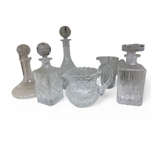 15 - Glassware - a ship's decanter and stopper;  others;  a heavy cut glass water jug;  etc