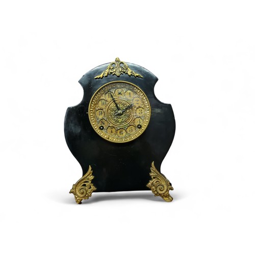 19 - A French cartouche shaped ebonised and gilt mantel clock, 12cm diam with Arabic numerals, two windin... 