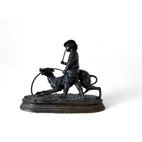 37 - After Jules Moigniez, a dark patinated bronze, boy with a greyhound and hoop, oval base, 26cm high