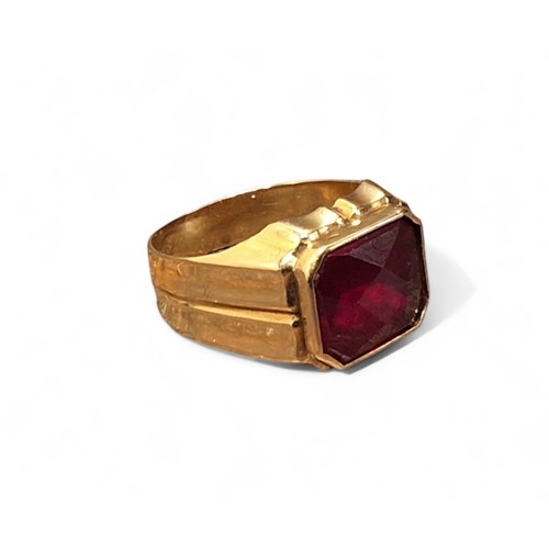 200 - A 14ct gold gentleman's signet ring, set with an emerald cut red stone approx. 9 x 11.3mm, size R, h... 