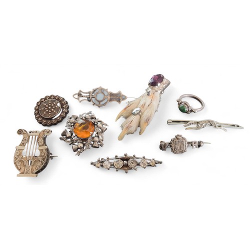 210 - A silver Scottish brooch, set with a central round orange stone, H Wright & Son, Edinburgh, 1954... 