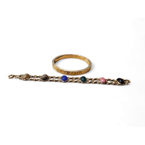 211 - A  bracelet, set with six scarab stones, 19cm long;  a gilt metal bangle (2)