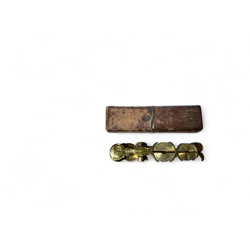 296 - Coins and Numismatics - a set of 19th century brass pocket scales, the Improved Sovereign Balance, b... 