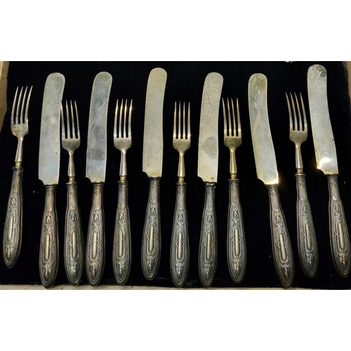 108 - A set of six Continental silver hafted fruit knives and forks, early 20th century