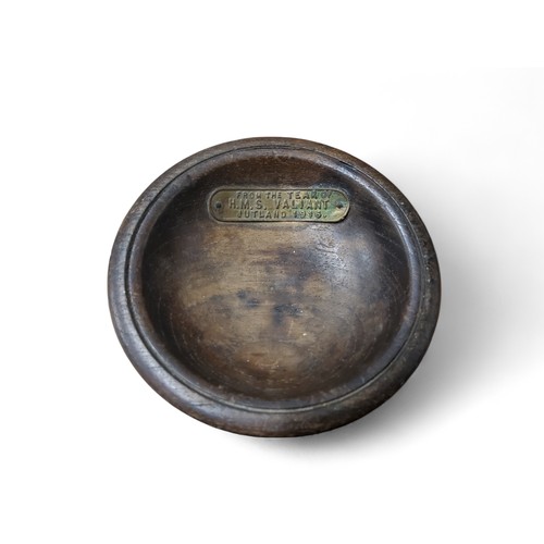 314 - An early 20th century circular pin dish, with plaque, From the teak of H.M.S. Valiant, Jutland 1916,... 