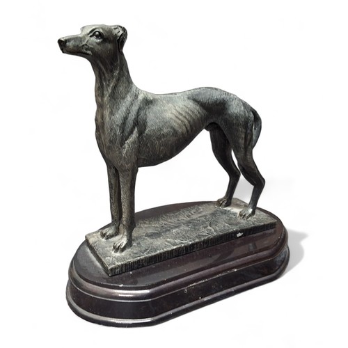 125 - A resin bronzed figure, of a greyhound, oval base, 23cm high;  another, greyhound pair, 19cm hi... 