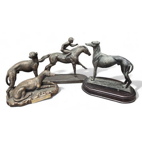 125 - A resin bronzed figure, of a greyhound, oval base, 23cm high;  another, greyhound pair, 19cm hi... 