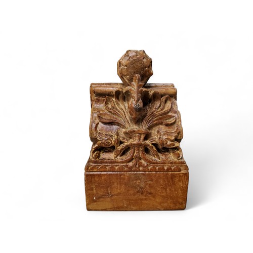 473 - A 19th century  Indian teak corbel, carved with stylised peacock, 258.5cm high, 18cm wide