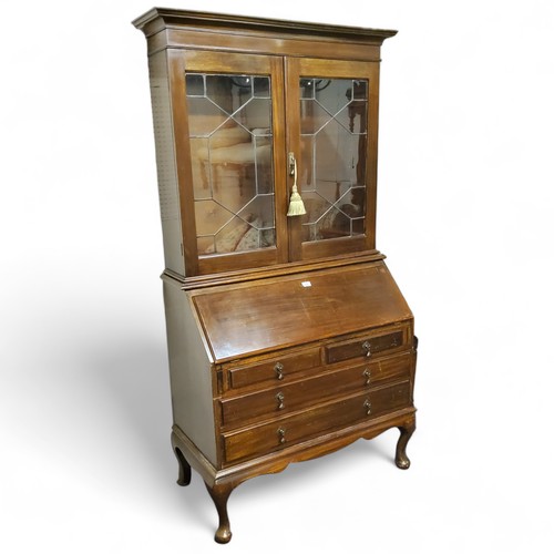 475 - An early 20th century mahogany bureau bookcase, 202cm high, 103cm wide,  c.1930