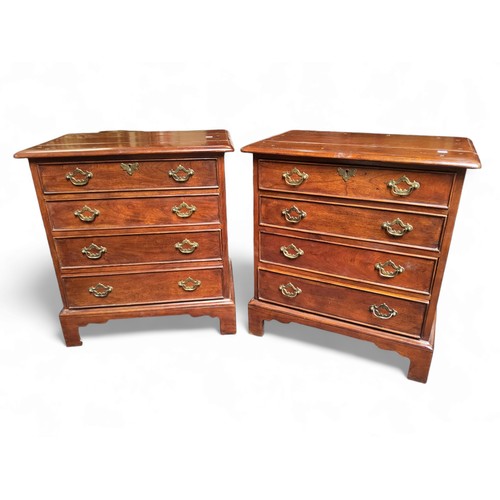 484 - A pair of George III revival bachelors chests of drawers, each holding four long graduated cock bead... 