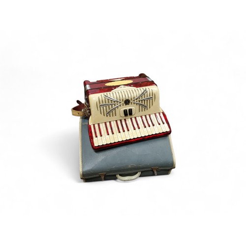 343 - An Italian Sonola 120 bass accordion, with two choir, 72 buttons, in red, cased