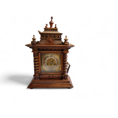 350 - A late 19th century German mantel clock, Arabic numerals, twin winding holes, striking on a gong, th... 